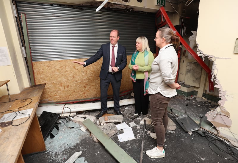 Minister Gordon Lyons meets with  Susan Duncan and Mo Sykes from the Welcome Organisation after recent damage caused to the building.
PICTURE COLM LENAGHAN