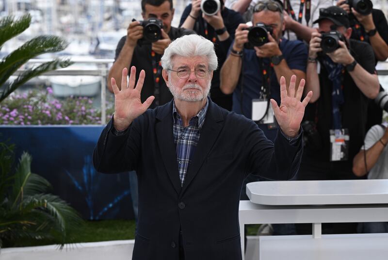 George Lucas attends a photocall as he has been awarded an Honorary Palme d’Or during the 77th Cannes Film Festival in Cannes, France