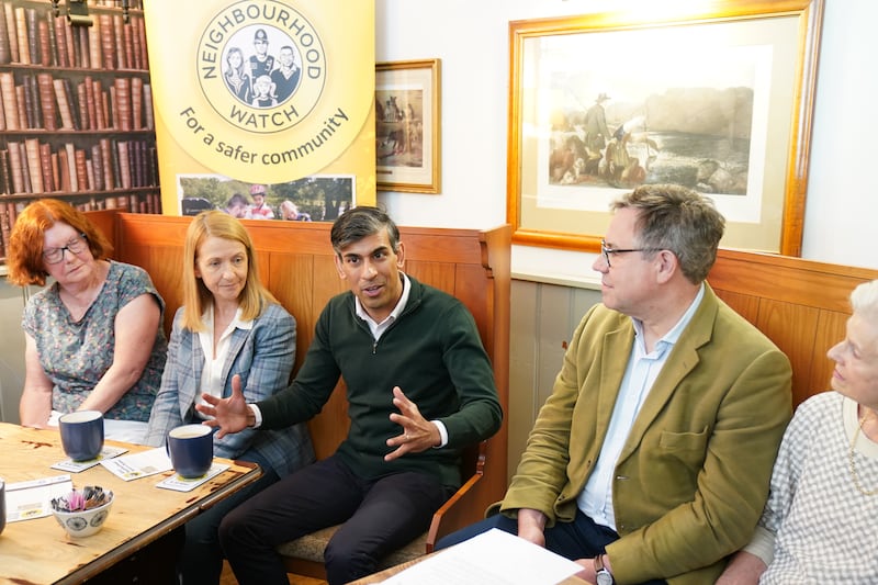Prime Minister Rishi Sunak attends a Neighbourhood Watch meeting at the Dog and Bacon pub in Horsham, West Sussex, while on the General Election campaign trail