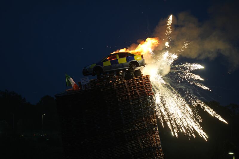 A mock police car is set alight on a bonfire in Moygashel near Dungannon, Co Tyrone