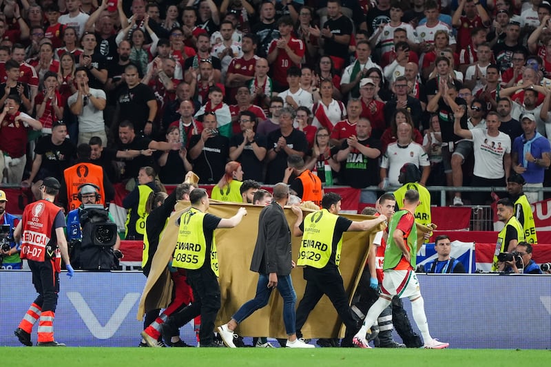 Varga leaves the pitch on a stretcher following an injury during Hungary’s clash with Scotland