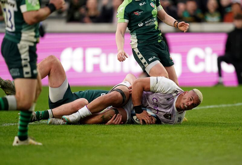 Northampton Saints' Juarno Augustus (right) scores a try during the Gallagher Premiership match at the Gtech Community Stadium, London. Picture date: Saturday March 25, 2023.