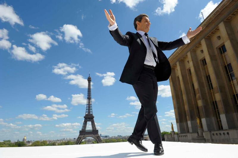 Nicolas Sarkozy reacts to supporters as he arrives on stage at Trocadero square in 2012 (AP)