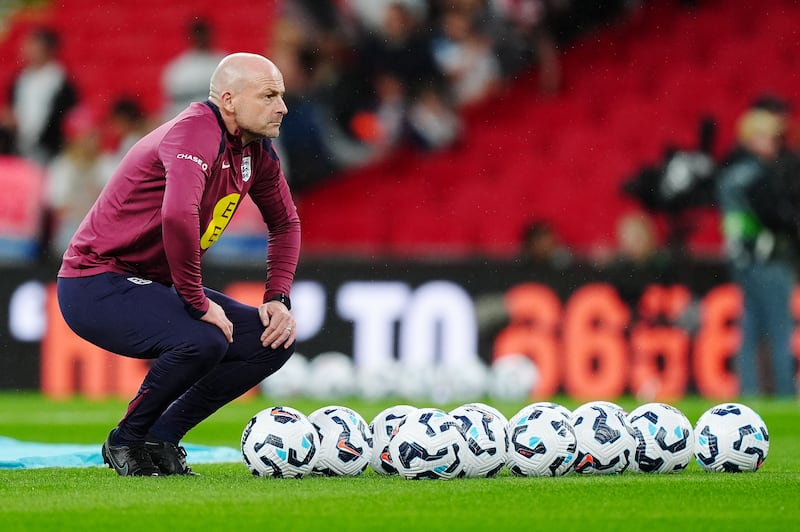 England interim manager Lee Carsley watches on during the warm up against Finland