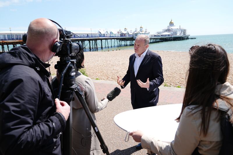 Liberal Democrat leader Sir Ed Davey speaks to the media on the promenade in Eastbourne while on the General Election campaign trail
