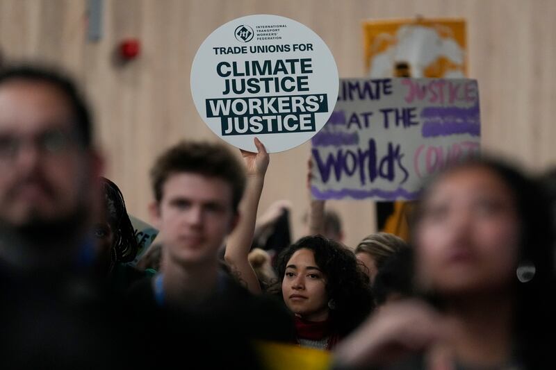 Activists participate in a demonstration for climate justice at Cop29 (Rafiq Maqbool/AP)