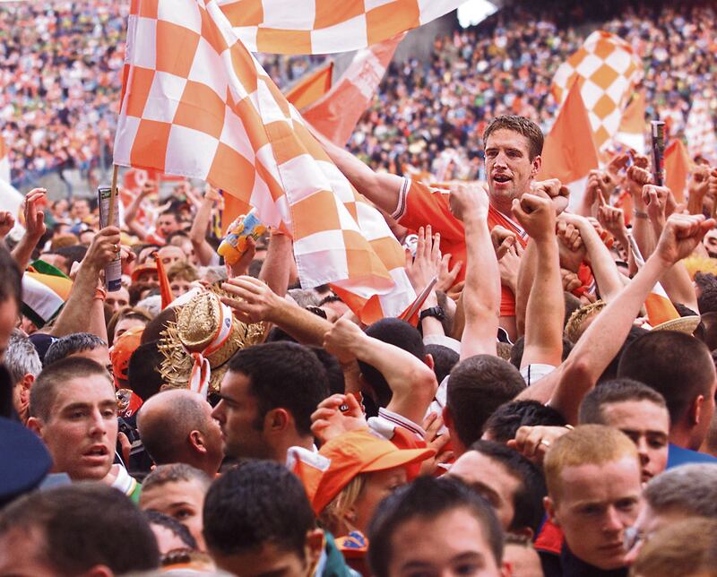 Armagh captain Kieran McGeeney is carried shoulder-high off the Croke Park pitch after the All-Ireland final win over Kerry in 2002, an era when fans knew more about players and any little bit of needle between teams was public knowledge. Picture: Ann McManus