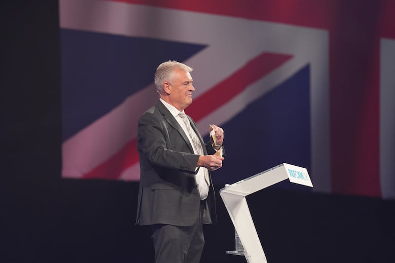 Reform UK MP Lee Anderson tears up his TV licence at the party’s annual conference at the National Exhibition Centre in Birmingham