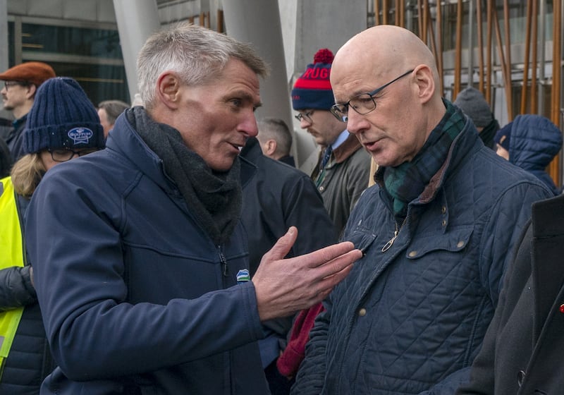 First Minister John Swinney, right, met with Jonnie Hall of NFU Scotland outside Parliament during the rally