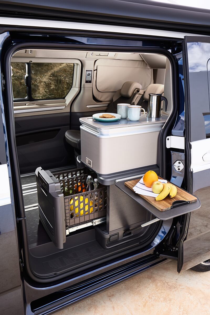 The California Coast and Ocean feature a full-size interior kitchenette, accessible from outside the camper