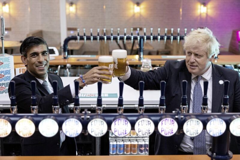 Boris Johnson (right) and Chancellor of the Exchequer Rishi Sunak pictured last year at Fourpure Brewery in London. Picture by Dan Kitwood/PA Wire 