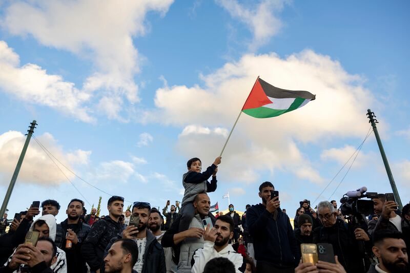 In Greece, a rally celebrating the fall of Assad was held in central Syntagma Square, in Athens, Greece (Yorgos Karahalis/AP)