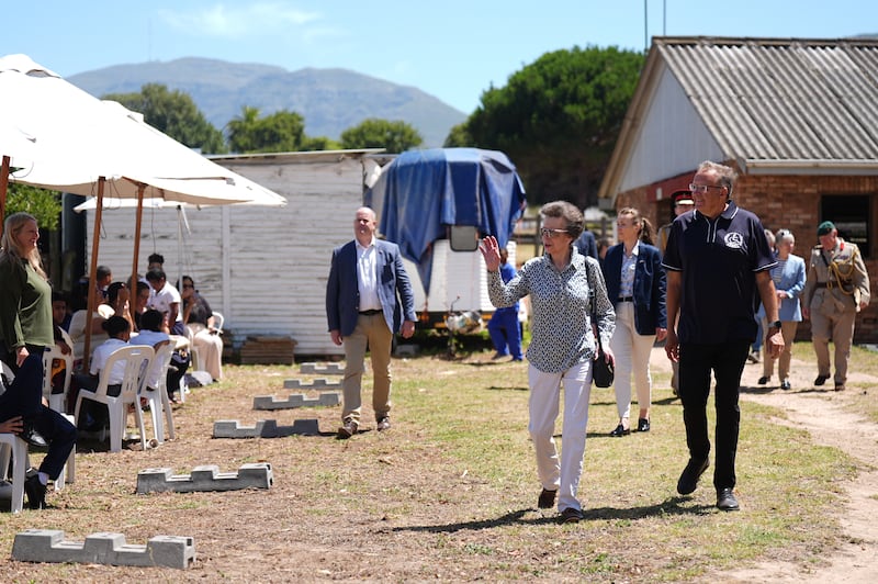 The Princess Royal waves during a visit to the South African Riding School for Disabled Association