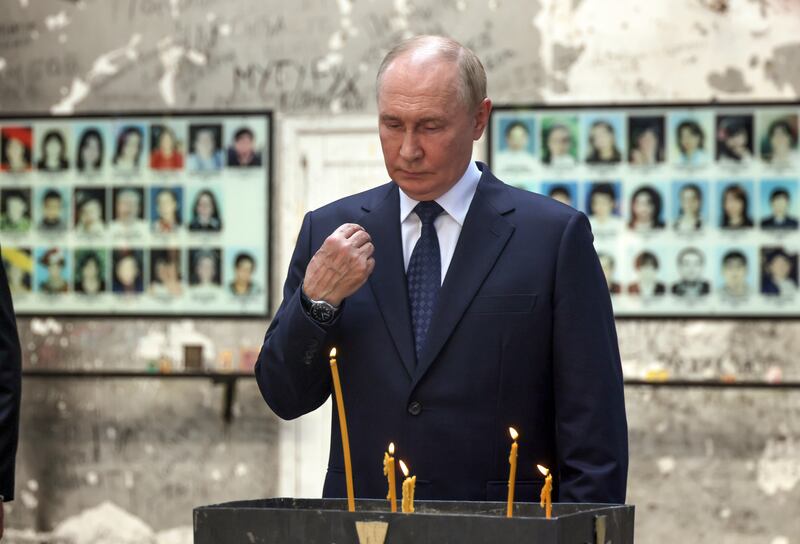 Vladimir Putin visiting a attacked by terrorists in 2004, in Beslan (Sergei Karpukhin, Sputnik, Kremlin Pool Photo via AP)