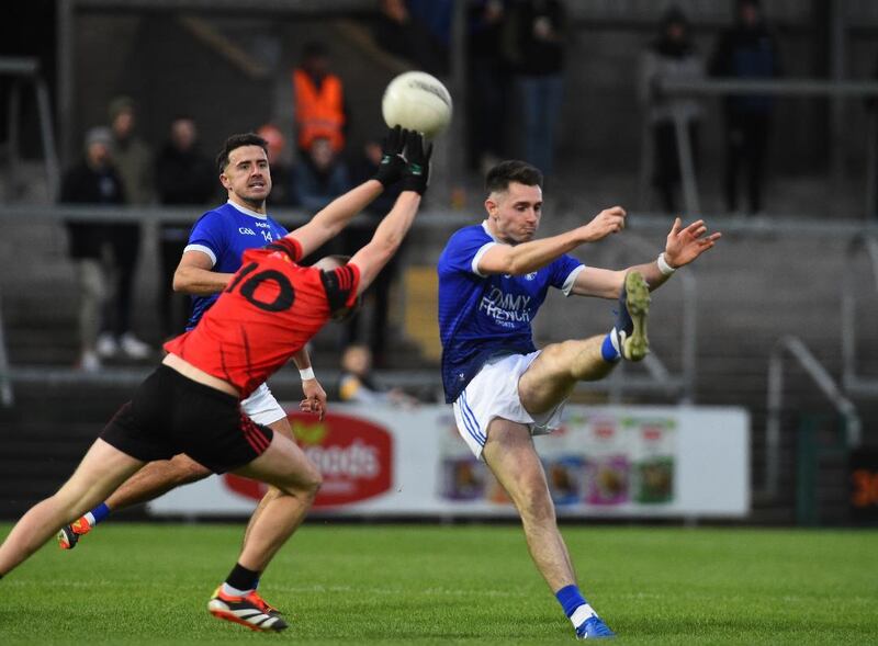 Shane McPartland of Clan na Gael takes aim with Stefan Campbell looking on as Madden's Joe Sheridan tries to block  PICTURE: John Merry