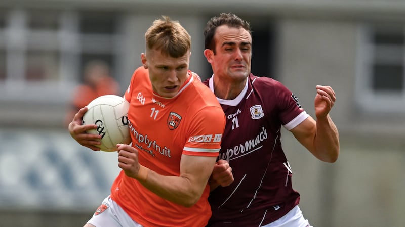 16 June 2024; Rian O'Neill of Armagh is tackled by John Maher of Galway during the GAA Football All-Ireland Senior Championship Round 3 match between Armagh and Galway at Markievicz Park in Sligo. Photo by Brendan Moran/Sportsfile