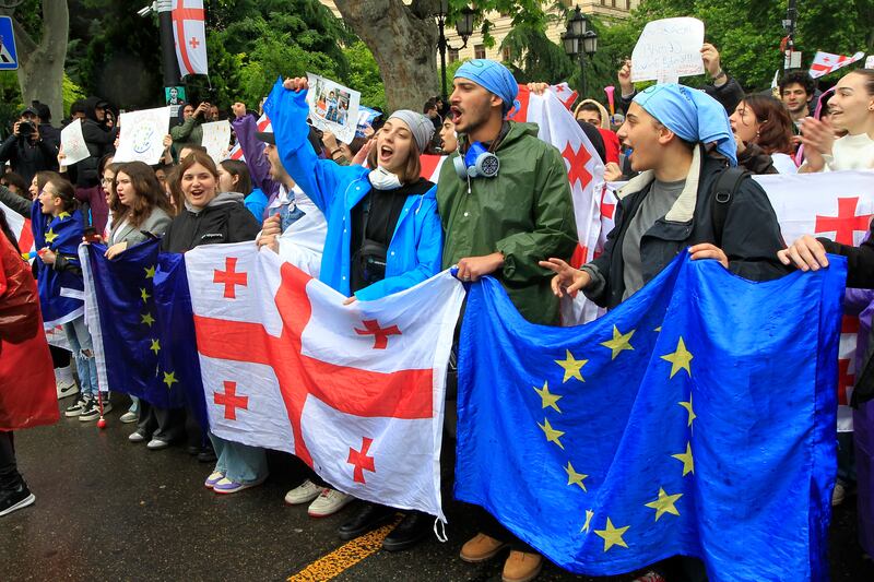Demonstrators attend a protest near the parliament building in Tbilisi, Georgia (Shakh Aivazov/AP)