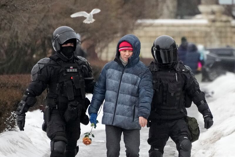 Police detain a man in St Petersburg, Russia (Dmitri Lovetsky/AP)