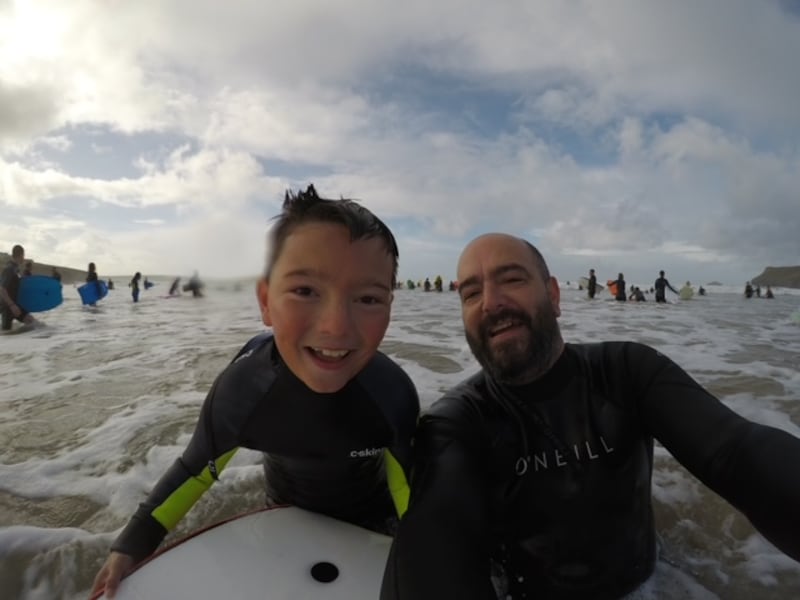 Barney and his father Darren surfing in Cornwall