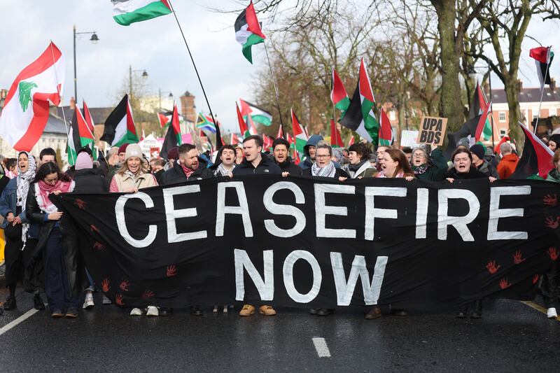 Pro-Palestine supporters march from Queen’s University  to to the US consulate on Sunday.
 PICTURE: COLM LENAGHAN