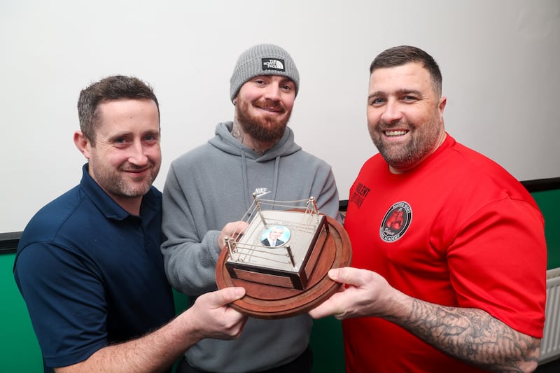 Hugh Russell and Eamon Magill present Lewis Crocker with the Eddie Shaw Trophey. PICTURE: MAL MCCANN