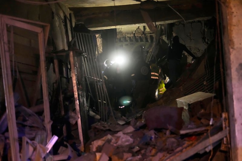 Rescue workers search for victims at the site of an Israeli airstrike in Beirut (Hussein Malla/AP)