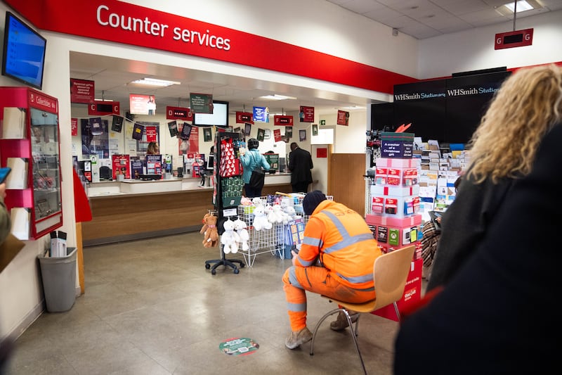 People inside a branch of the Post Office in Paddington, London