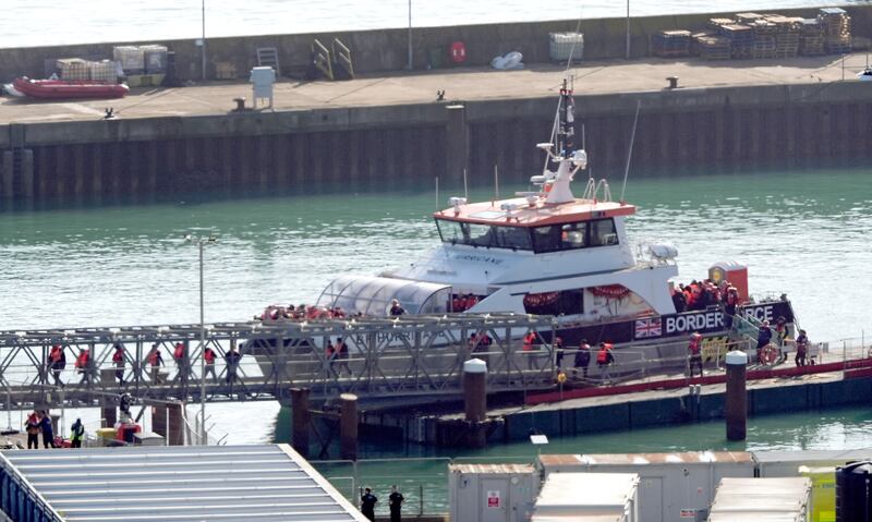 A group of people thought to be migrants are brought in to Dover from a Border Force vessel on Friday