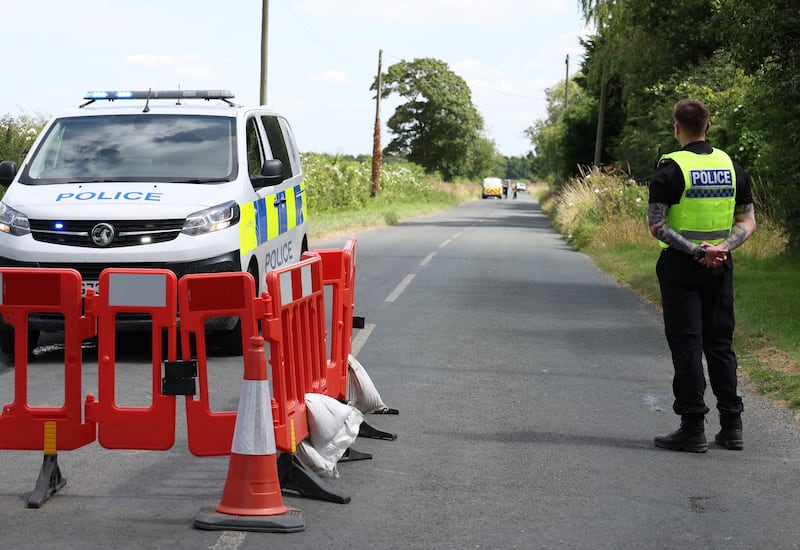 Police near to the scene of an incident involving a light aircraft at Thorganby near York