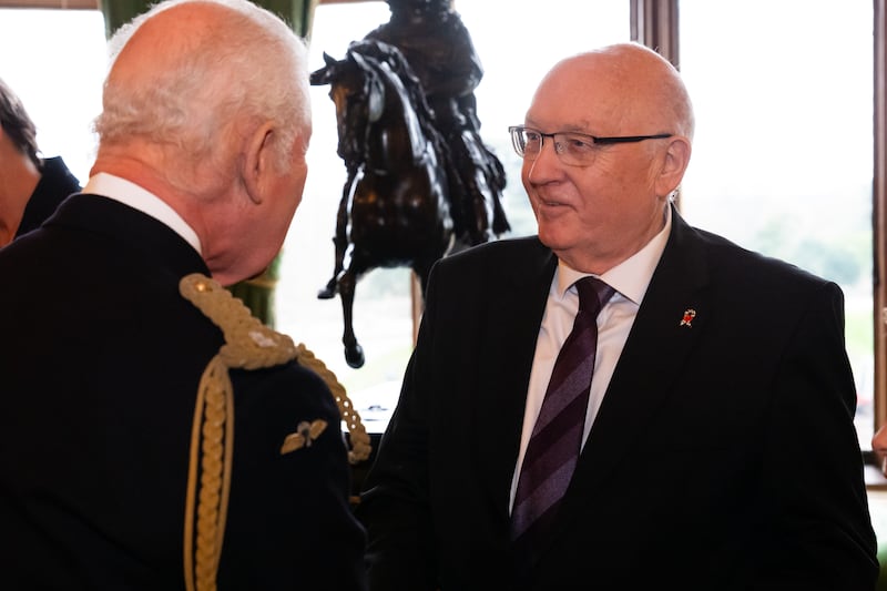 King Charles III presents an Elizabeth Emblem to Paul Bone, for Police Constable Fiona Bone who served with Greater Manchester Police