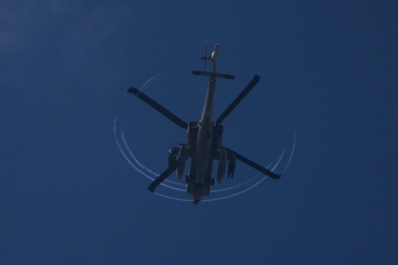 An armed Israeli Apache helicopter is seen from northern Israel (AP Photo/Leo Correa)