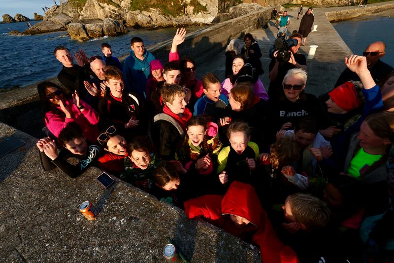 Supporters  of Daniel Wiffen cheer on while streaming on phones during a watch party  at Portmuck Bay for the Olympic 800m freestyle final on Tuesday evening.
PICTURE COLM LENAGHAN