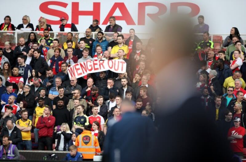 Arsenal fans with a Wenger out banner