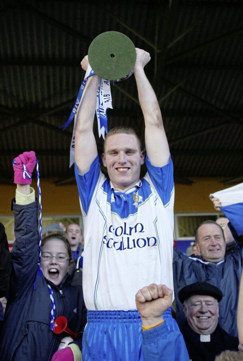 Ballinderry captain Adrian McGuckin holds the Andy Merrigan Cup aloft after victory over Nemo Rangers in the All-Ireland Club final. Pic John McAviney 