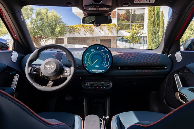 The interior features a 2D knitted dashboard, which is also made from recyclable materials. (Mini)