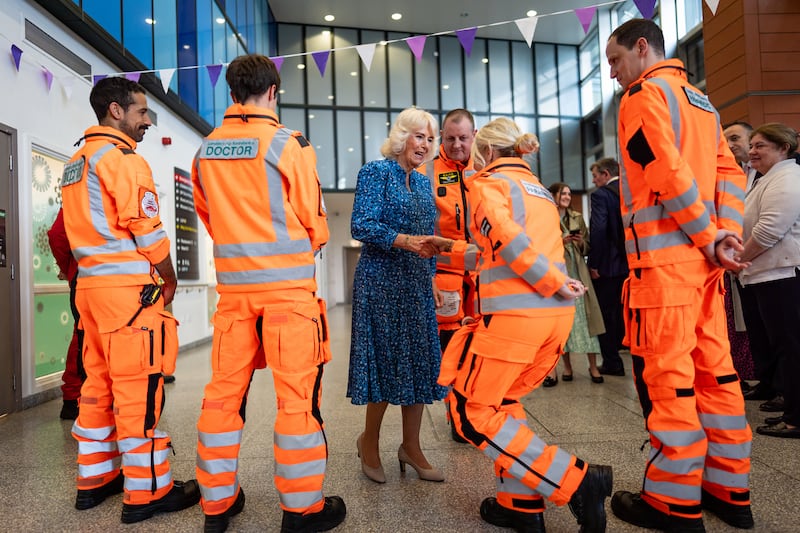 The Queen meets members of the air ambulance service during a visit to the Royal London Hospital