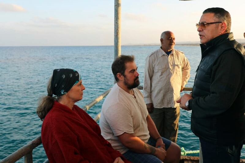 Amr Hanafi speaks to survivors (Egyptian Press Centre/AP)