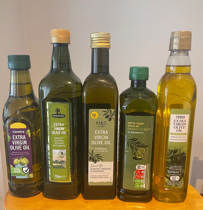 Five bottles of extra virgin olive oil