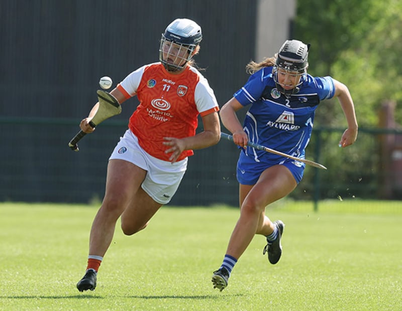 Armagh's Sinead Quinn soloing the sliothar past Aoife Finlay of Laois