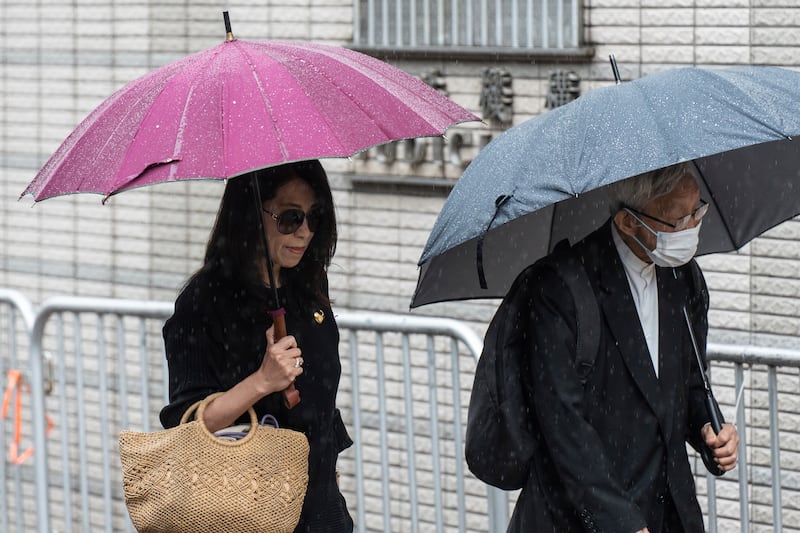 Jimmy Lai’s wife Teresa Lai and retired Chinese cardinal Joseph Zen Ze-Kiun were at West Kowloon Magistrates’ Courts (AP)