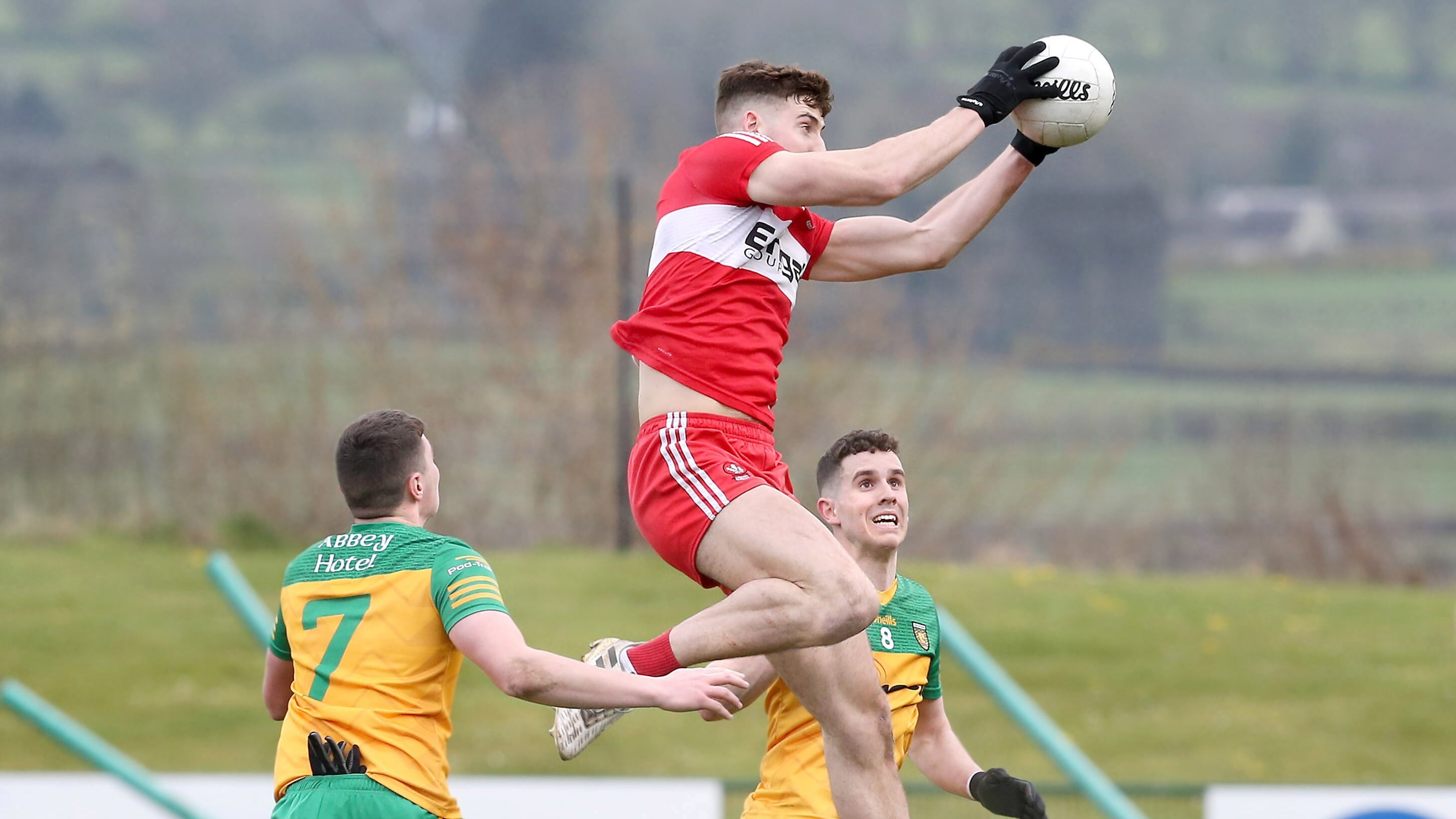 Derry’s Dan Higgins with Karl McGee and Christy Mulligan of Donegal during the  EirGrid Ulster U20 Football Championship sem-final at Owenbeg on Saturday     Picture: Margaret McLaughlin.