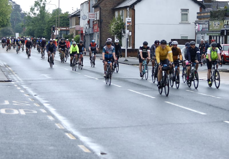 Cyclists pass through Epping town centre in Essex