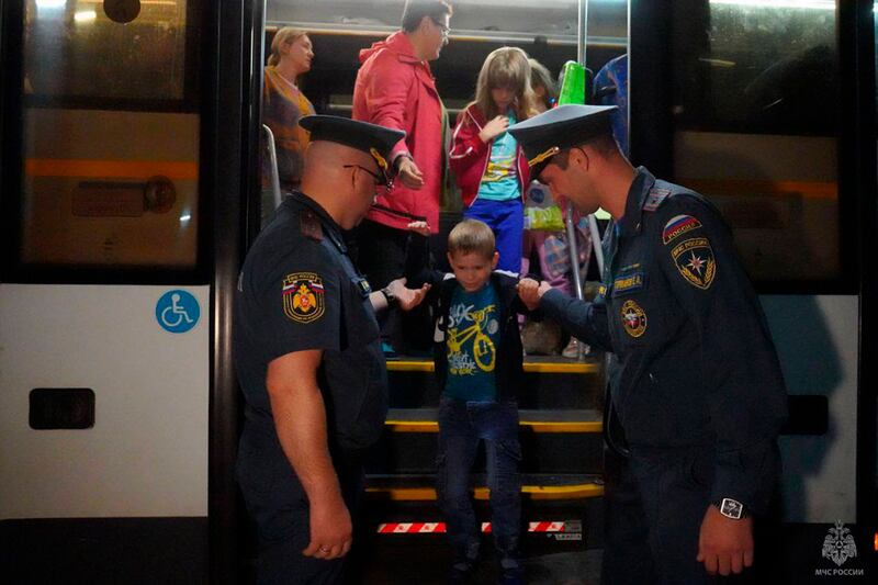 People evacuated from fighting between Russian and Ukrainian forces in the Kursk region arrive at a temporary residence centre in Moscow (Russian Emergency Ministry Press Service/AP)