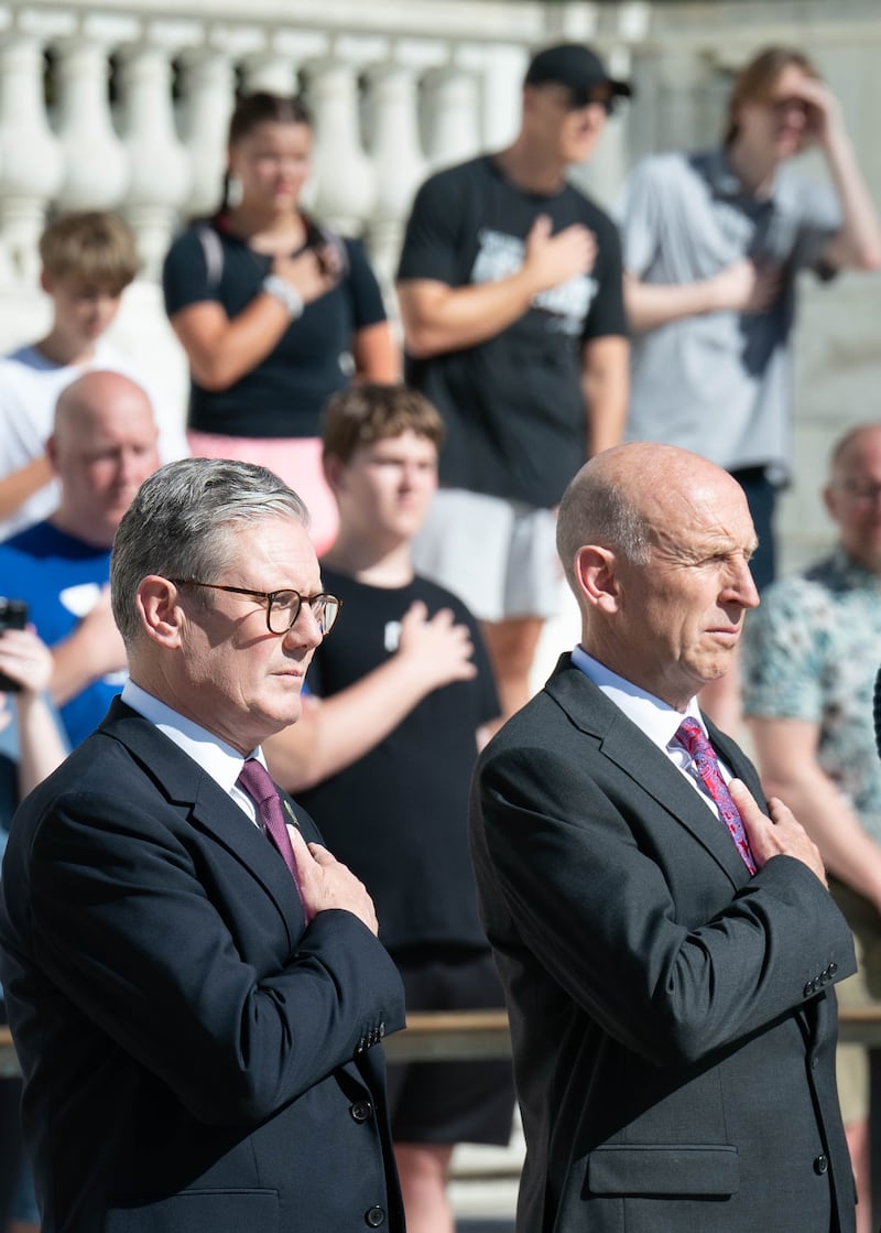 Prime Minister Sir Keir Starmer with Defence Secretary John Healey at the Tomb of the Unknown Soldier at Arlington National Cemetery in Washington DC