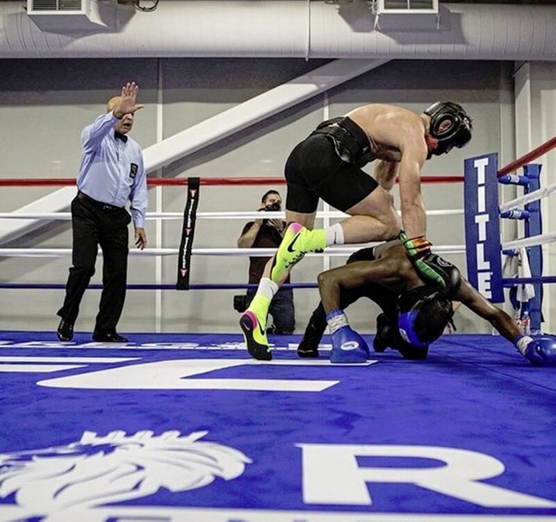 Conor McGregor prepares to go in for the kill against sparring partner Frans Mlambo, as referee Joe Cortez gets ready to intervene 