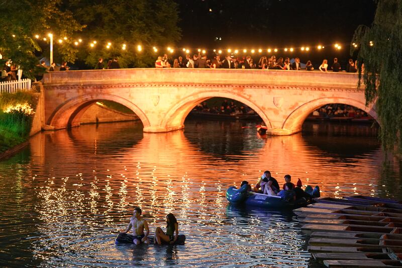 People watch a firework display over the River Cam