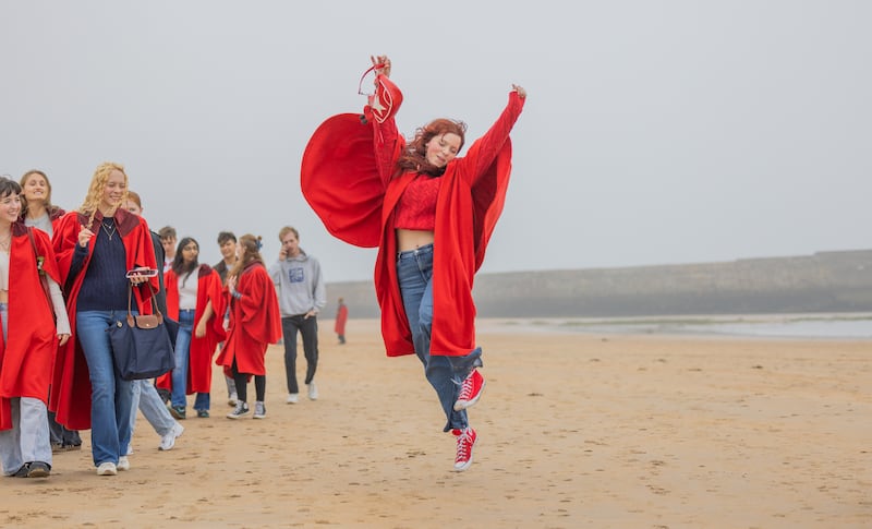 Students celebrate the start of the new term on East Sands .