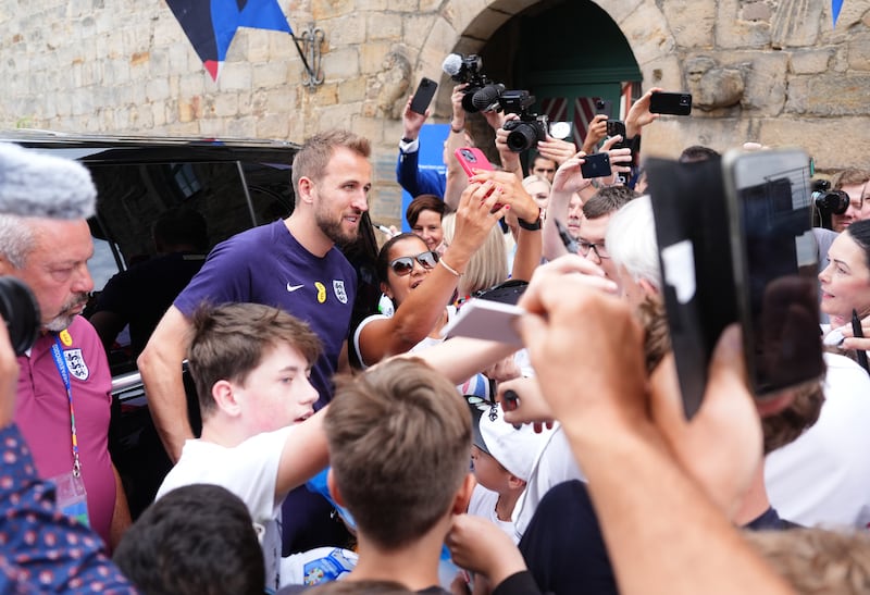 England captain Harry Kane met fans outside the team’s base in Blankenhain