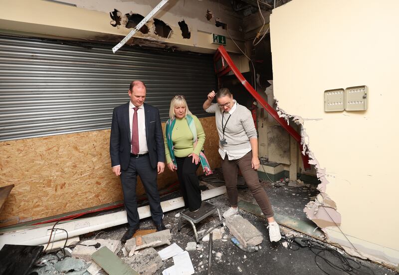 Minister Gordon Lyons meets with  Susan Duncan and Mo Sykes from the Welcome Organisation after recent damage caused to the building.
PICTURE COLM LENAGHAN