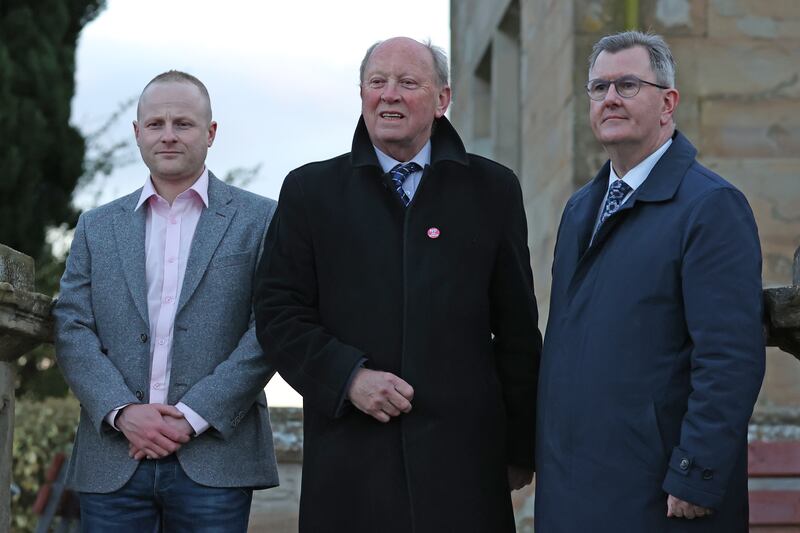 (l to r) Jamie Bryson, Jim Allister and DUP leader Sir Jeffrey Donaldson attend a rally in opposition to the Northern Ireland Protocol in Lurgan, County Armagh in 2022